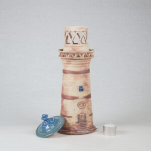 Wheel-thrown pottery lighthouse in blue arch window design